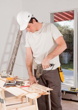 Handy Man Drilling clipart