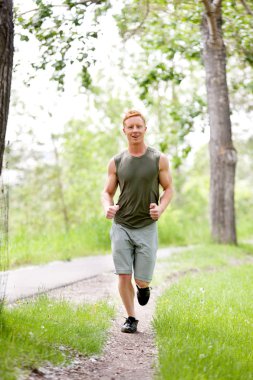 Young man jogging clipart