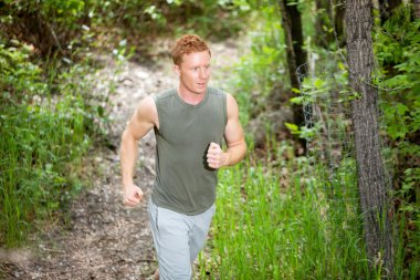 Young man jogging clipart