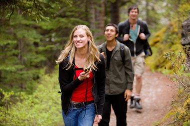 Woman with GPS in Forest clipart