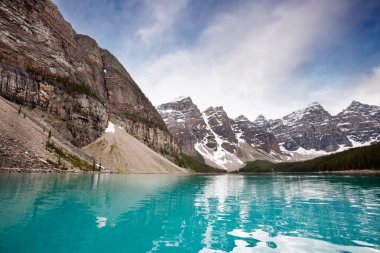 Calm water and mountain range clipart