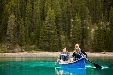 Couple Portrait in Canoe clipart