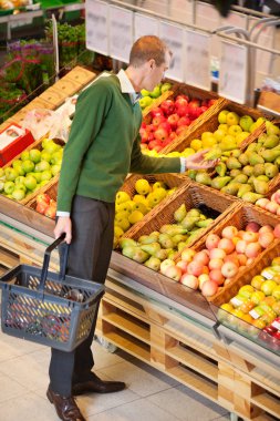 Man Buying Fruit clipart