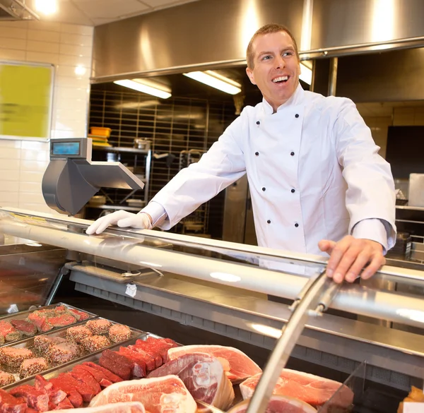 Vista de la carne congelada con el chef alegre —  Fotos de Stock