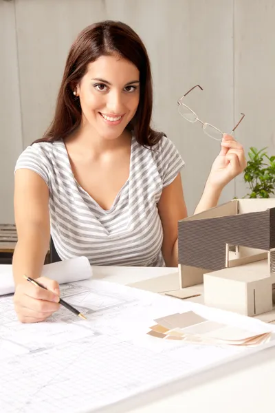 Architect with Blueprints and House Model Stock Photo