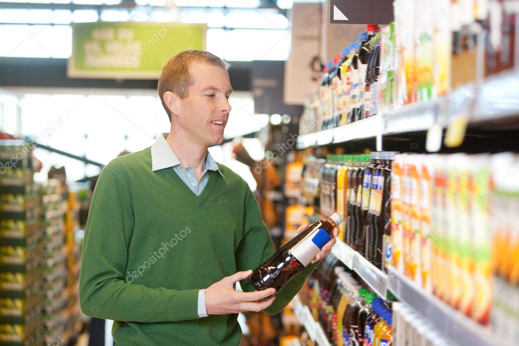 Customer buying bottle of juice