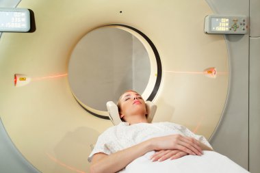 Woman Taking CT Scan clipart