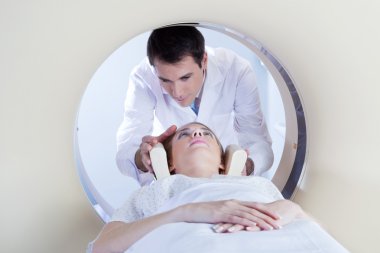 Patient going through MRI test clipart