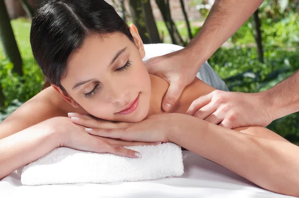 Attractive Caucasian woman getting massaged — Stock Photo, Image