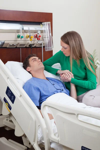 Man on a hospital bed — Stock Photo, Image
