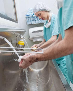 Surgeons washing hands clipart