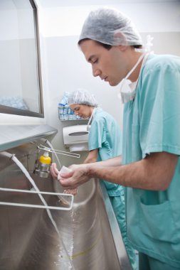 Doctors washing hands clipart