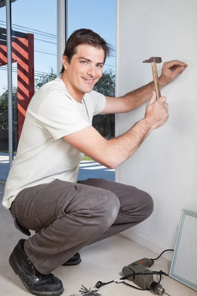 Young man with hammer — Stock Photo, Image