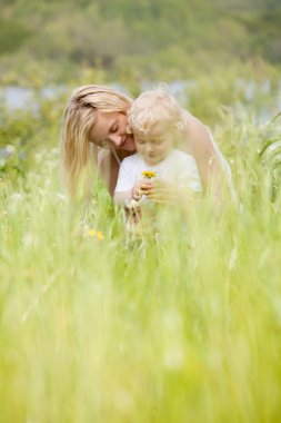 Mother and Son in Green Meadow clipart