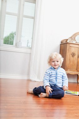 Kid sitting on floor clipart