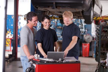 Mechanics Using Laptop clipart