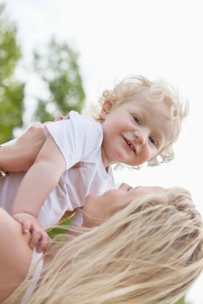 Baby and mother in playful mood — Stock Photo, Image