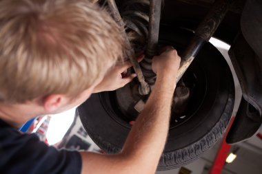 Mechanic Inspecting CV Joint clipart