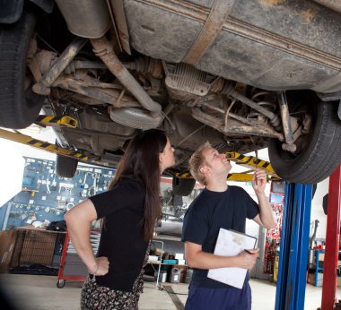 Mechanic Showing Customer Repairs clipart