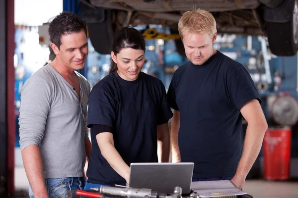 Mechanics with Laptop Royalty Free Stock Images