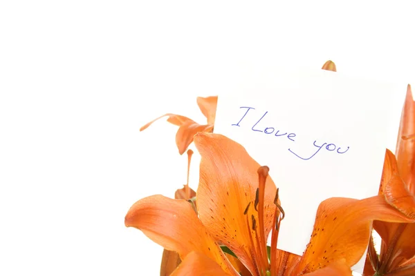 Blumen mit einer Karte mit dem Text Ich liebe dich — Stockfoto