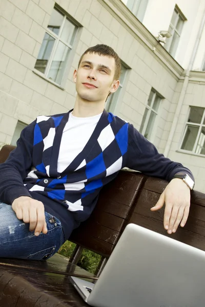 Young student working on a laptop — Stock Photo, Image