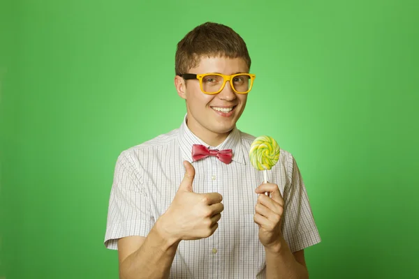 Young man with a lollipop — Stock Photo, Image