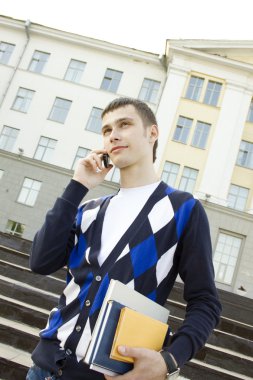 Student man talking on the phone clipart