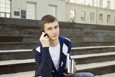 Modern student talking on a mobile phone clipart