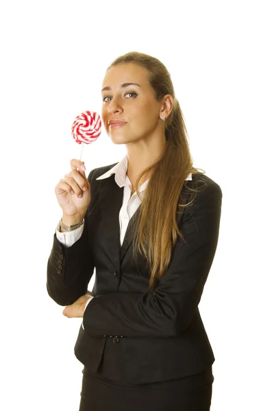 Aantrekkelijke zakenvrouw met een lolly — Stockfoto