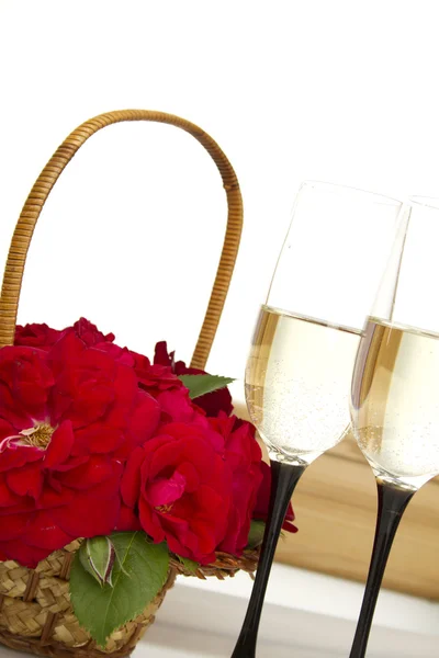 Basket with roses and champagne — Stock Photo, Image