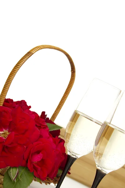 Basket with roses and champagne — Stock Photo, Image