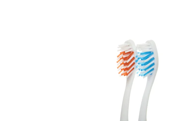 Röda och blå tandborstar — Stockfoto