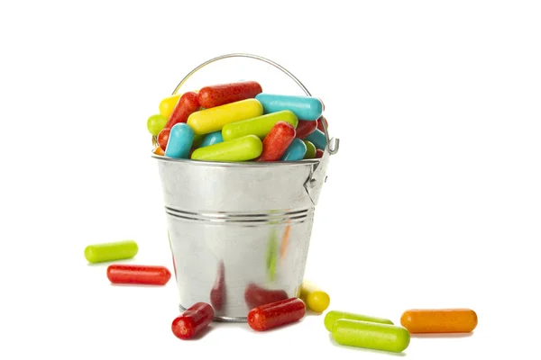 Colored candy in the bucket — Stock Photo, Image