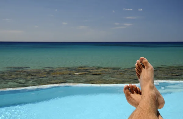 Picture of male legs over swimming pool — Stock Photo, Image