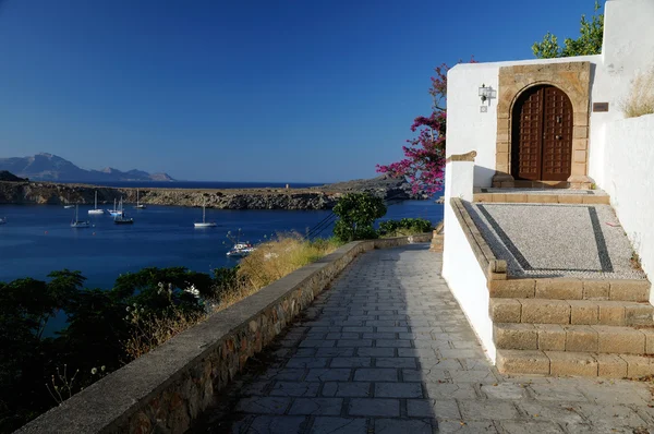 stock image Lindos old street with sea view