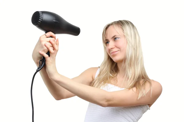Mujer y secador de pelo aislado en blanco (enfoque en el secador de pelo ) — Foto de Stock