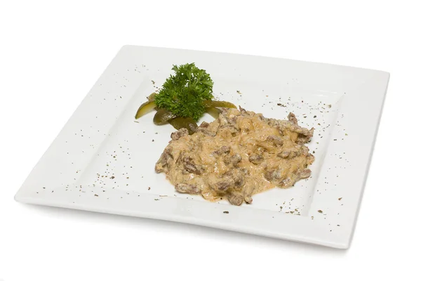 Beef stroganoff on white plate isolated - Russian cuisine — Stock Photo, Image