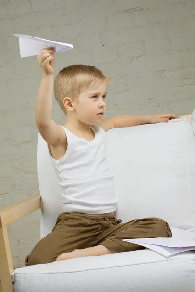 Child boy with paper airplane — Stock Photo, Image