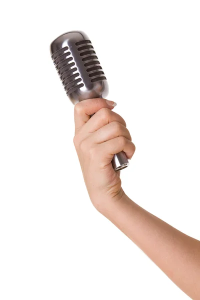 Microfone na mão feminina isolado no branco — Fotografia de Stock