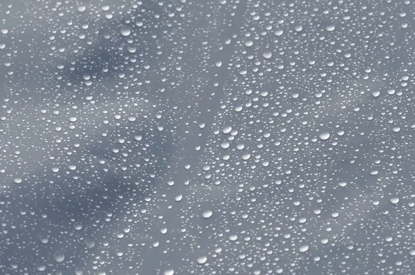 Gotas de chuva na textura plástica — Fotografia de Stock