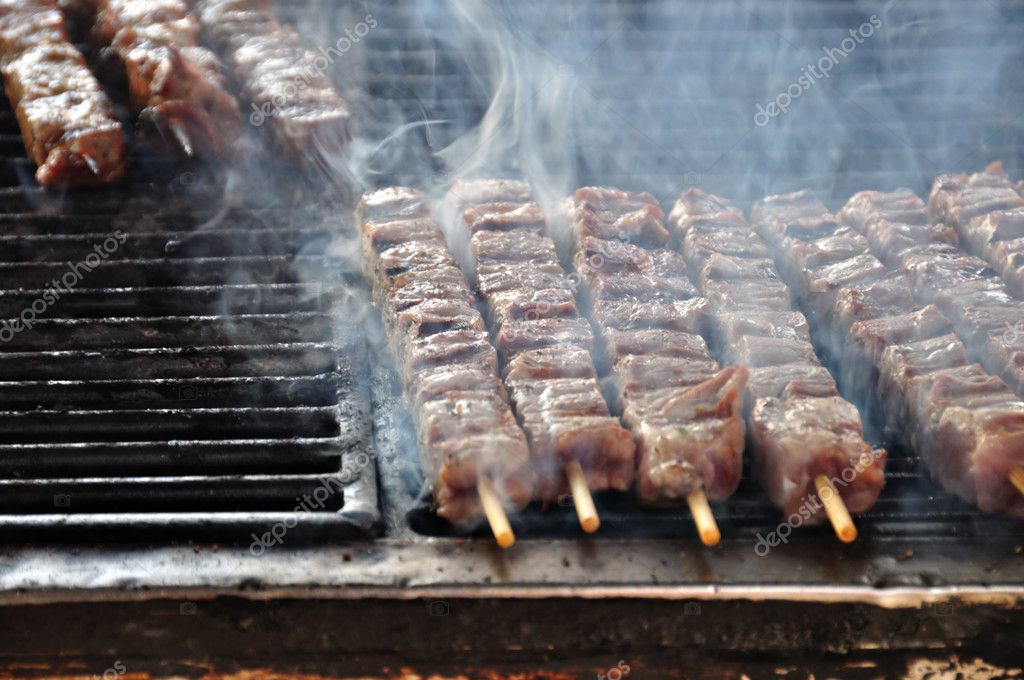 Souvlaki meat skewers on hot grill - Stock Photo, Image. 