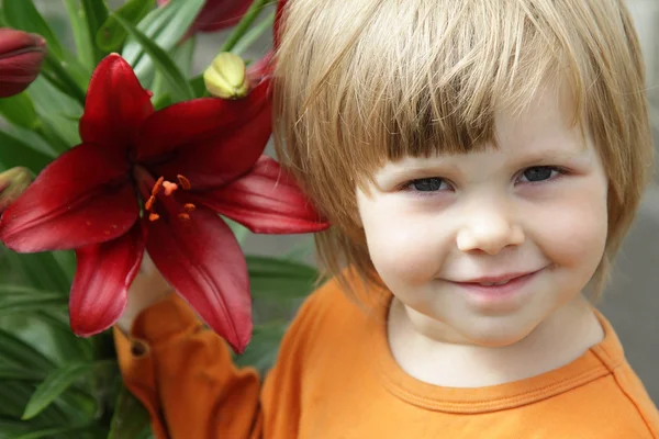 Little girl with a lily — Stock Photo, Image