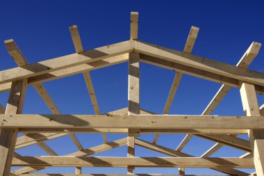 Wooden roof during the early stages of construction clipart