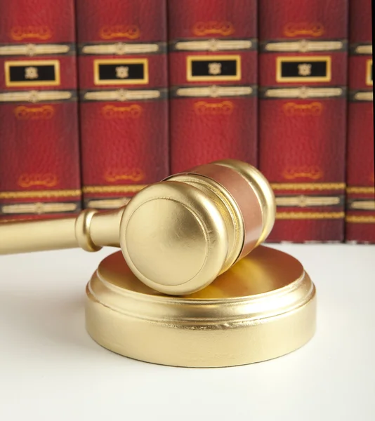 Wooden gavel and sound block backlit — Stock Photo, Image