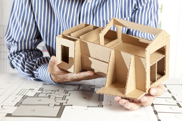 Architect with model house — Stock Photo, Image