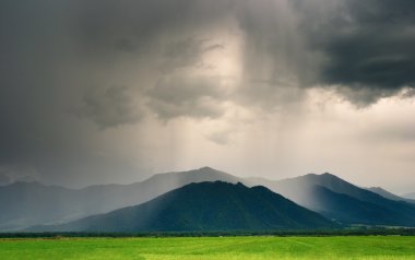 Cloudburst in mountains clipart