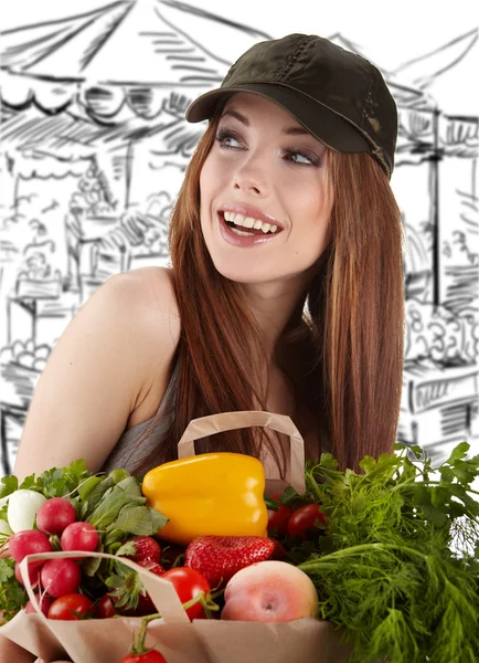 Woman holding a bag full of healthy food. shopping . Royalty Free Stock Images