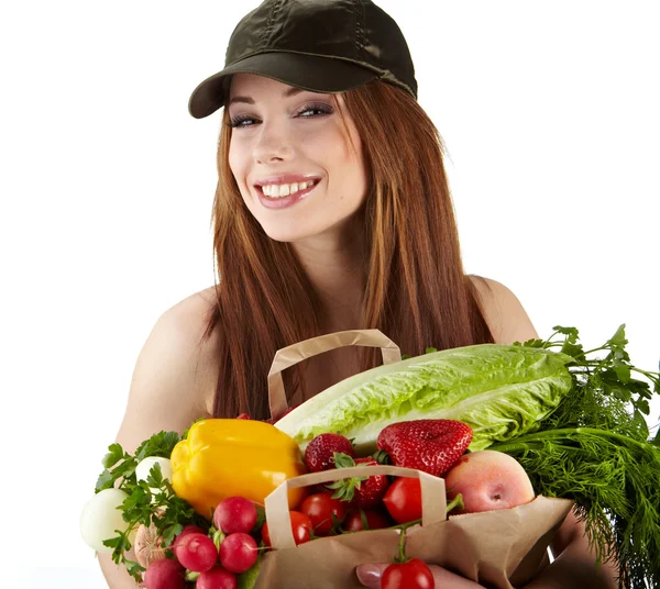 Portrait of happy woman holding a shopping bag full of groceries — Stock Photo, Image