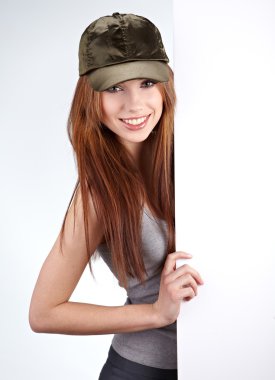 Beautiful woman holding empty white board